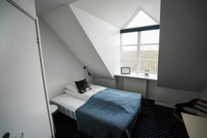Postel nebo postele na pokoji v ubytování Hotel Aarslev Kro + 37 fotografií