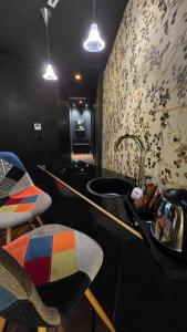 a kitchen with a sink and a counter top at Alba Suites in Vlorë