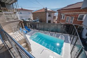 an overhead view of a swimming pool on a balcony at Villa DukiBalo in Ohrid