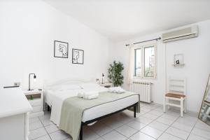 Ένα ή περισσότερα κρεβάτια σε δωμάτιο στο Residenza mediterranea golfo orosei