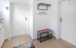 a hallway with a small table in a room at Cozy Apartment In Malchow With Wifi in Malchow