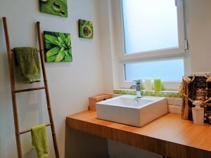 a bathroom with a sink and a window at l'Isle Contemporaine Centre ville de L'Isle sur la sorgue 74 m2 clim parking in LʼIsle-sur-la-Sorgue +30 photos