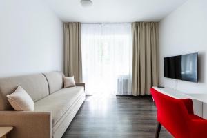 TV a/nebo společenská místnost v ubytování Hotel Vila Viola