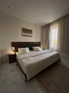 Ένα ή περισσότερα κρεβάτια σε δωμάτιο στο مسكن ترف 1