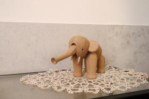a wooden toy elephant sitting on top of a table at Appartamenti centro città Downtown Aitne in Catania