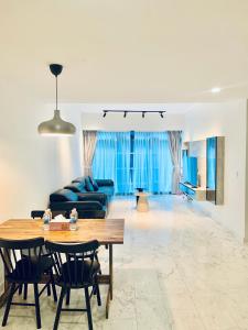 a living room with a table and a couch at Eaton Suites KL By Luna in Kuala Lumpur +197 photos