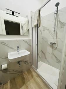 a bathroom with a sink and a shower at B&b Al Centro Nicosia in Nicosia