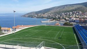 a tennis court on the side of the water at Jasmina in Senj