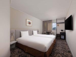 ibis Ambassador Seoul Insadong-Newly renovated in 2025にあるテレビまたはエンターテインメントセンター
