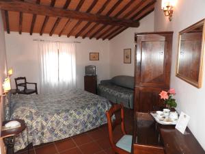 Posteľ alebo postele v izbe v ubytovaní Relais Borgo Di Toiano
