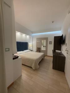 Postel nebo postele na pokoji v ubytování IG-Tysandros Hotel Apartments