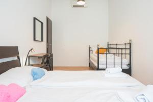 Postel nebo postele na pokoji v ubytování ATIK ROOMS