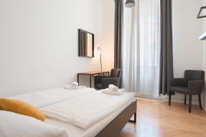 Postel nebo postele na pokoji v ubytování ATIK ROOMS
