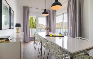 a dining room with a large white table and chairs at Villa Esperanza in Canillas de Albaida