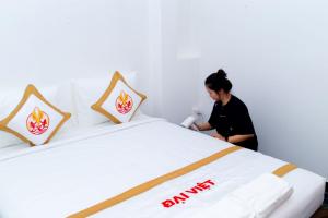 Postel nebo postele na pokoji v ubytování The Rice 131 Bui Vien Hotel