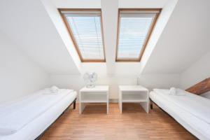 Postel nebo postele na pokoji v ubytování ATIK ROOMS