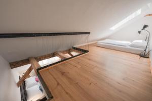 Postel nebo postele na pokoji v ubytování ATIK ROOMS