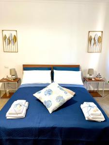 Ένα ή περισσότερα κρεβάτια σε δωμάτιο στο ROMA GOLDEN BEACH Apartment
