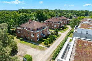 an aerial view of a large brick house at Goosbrink Wohnung 13 in Boltenhagen