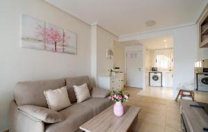 a living room with a couch and a table at Amazing Apartment In Oropesa Del Mar in Oropesa del Mar