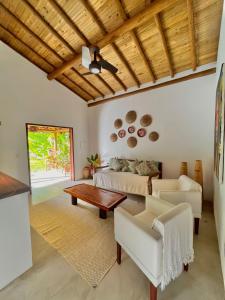 a living room with a couch and a table at CASA RENASCER in Trancoso