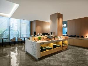 a kitchen with a counter with food on it at Starway Hotel Guilin Two Rivers and Four Lakes Scenic Area in Guilin