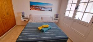 En eller flere senge i et værelse på Casa Fayna