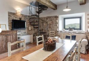 a kitchen and dining room with a table and chairs at Historic Villa In The Florence Hills in Borgo San Lorenzo