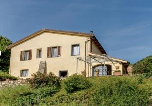a house on the side of a hill at Historic Villa In The Florence Hills in Borgo San Lorenzo
