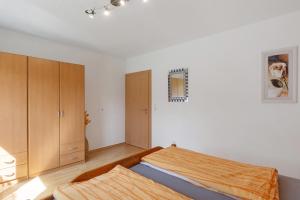 Postel nebo postele na pokoji v ubytování Ferienwohnung Eva
