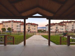 a view of a park with buildings in the background at Seagull Apartments in Byala