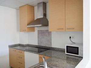 Kuchyňa alebo kuchynka v ubytovaní Apartamentos Benicarló Lowcost 3000