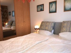 Postel nebo postele na pokoji v ubytování Nautilus, Ferienwohnung 22