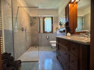 a bathroom with a shower and a sink and a toilet at Casa Iris in Omegna +51 photos