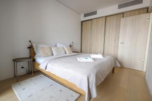 a bedroom with a large bed in a room at SKAU Sky Park Green by Zaha Hadid 22 floor 1 Tower Panoramic View Free Parking in Bratislava
