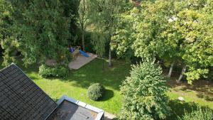 an aerial view of a backyard with a playground at Appartementhaus Brunsholm in Esgrus