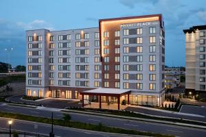 a hotel building with a gazebo in front of it at Hyatt Place Montreal Airport in Dorval