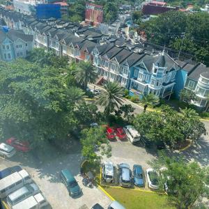 an aerial view of a city with cars parked in a parking lot at Townhouse Mellow Yellow D#220 3storey 120sqm in Batangas City