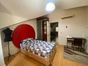 a bedroom with a bed and a desk in a room at Townhouse Mellow Yellow D#220 3storey 120sqm in Batangas City +21 photos