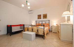 a bedroom with a bed and a tv in it at Lovely Home In Avella in Avella