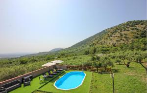 a swimming pool with a view of a mountain at Lovely Home In Avella in Avella