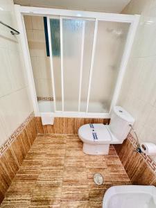 a bathroom with a toilet and a window at T252 - Atrium Beach 2 - 2004 Finestrat in Cala de Finestrat