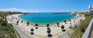 a view of a beach with blue water at Castle House and Beach in Sines