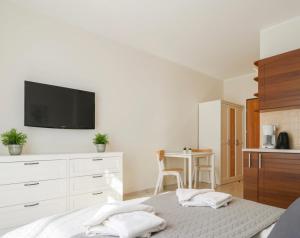 Et tv og/eller underholdning på Apartament Costa Promenada