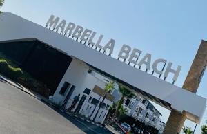a manhattan beach sign on top of a building at Elegant & spacious with a view in Mansouria