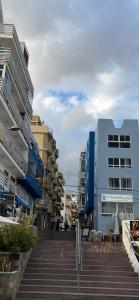 een groep gebouwen en trappen in een stad bij CORNELIAS HOME 5A playa in Los Cristianos