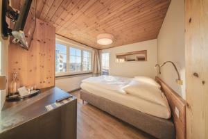 Postel nebo postele na pokoji v ubytování Hotel Quellenhof - Self Check-in & Adults Only