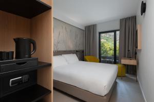 Postel nebo postele na pokoji v ubytování Hotel Royal Village