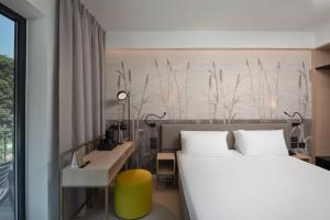 Postel nebo postele na pokoji v ubytování Hotel Royal Village