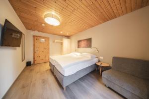Postel nebo postele na pokoji v ubytování Hotel Quellenhof - Self Check-in & Adults Only + 31 fotografií